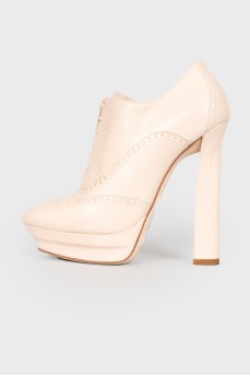 Beige perforated ankle boots