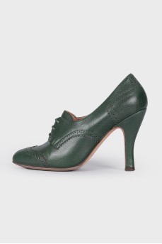 Green ankle boots with perforation