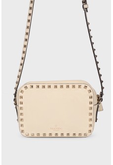 Milk-colored bag with spikes