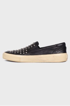 Black slip-on shoes with spikes