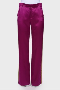 Purple trousers with stripes