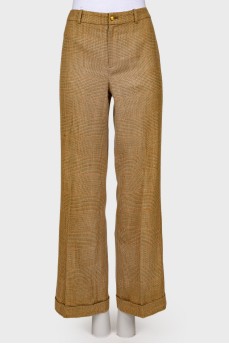 Plaid trousers with golden buttons