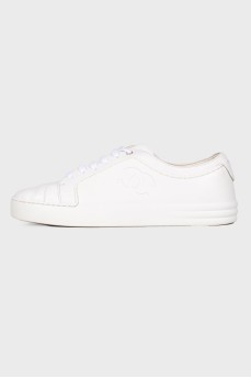 White sneakers with brand logo