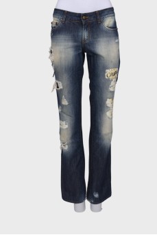 Ripped and washed effect jeans with print