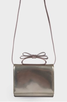 Silver bag with a bow on the handle