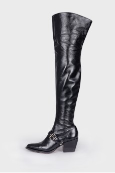 Leather over the knee boots with a strap