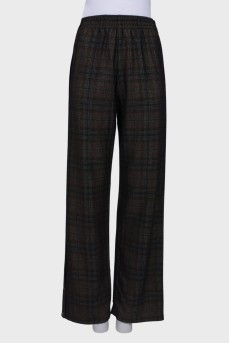 Wool trousers with press-studs on the sides