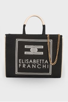 Textile bag with embroidered brand logo