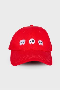 Red cap with embroidery, with a tag