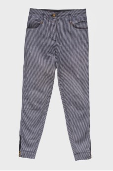 Striped trousers with zip at the bottom