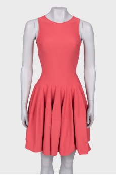 Coral dress close-fitting in the waist