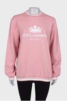 Pink sweater with brand logo