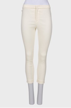 Cream trousers with tag