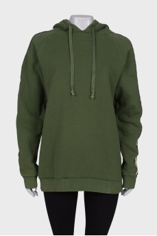 Green hoodie with brand logo