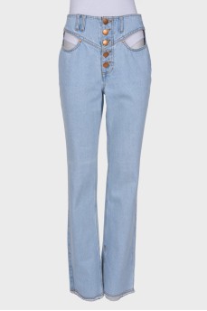 Light blue jeans with slits at the waist
