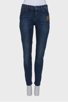 Navy blue jeans with a patch