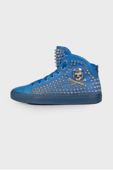 Blue sneakers decorated with spikes