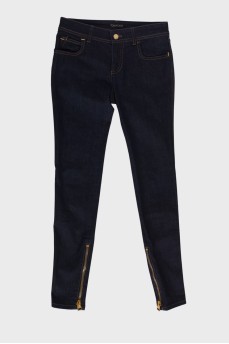Dark blue jeans with a zip at the bottom