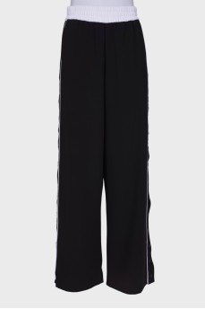 Black and white trousers with press-stud closure