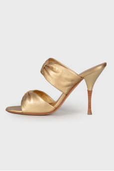 Golden mules with stiletto heels