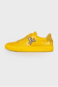 Yellow metal skull sneakers