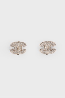 Silver earrings in the shape of the brand logo
