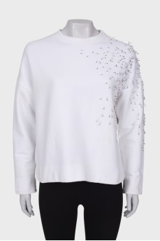 White sweatshirt with appliqué