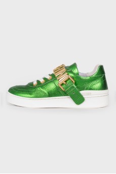 Green sneakers with brand logo