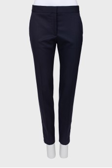 Navy blue trousers with a zip at the bottom