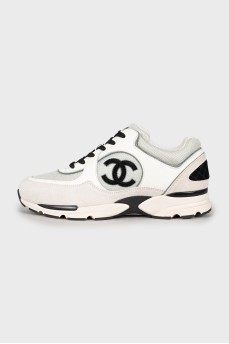 Black and white sneakers with brand logo