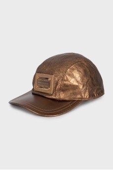 Golden cap with brand logo