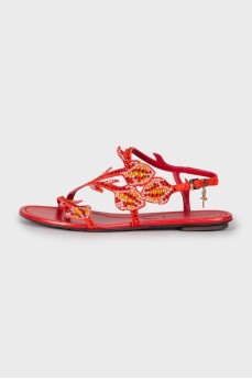 Red sandals decorated with rhinestones