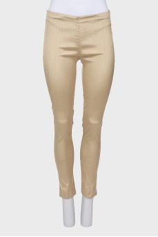 Beige trousers with slits at the bottom