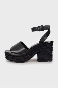 Black sandals with woven soles