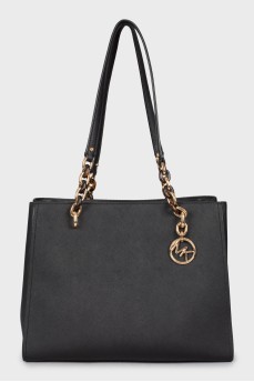Leather bag with golden keyring