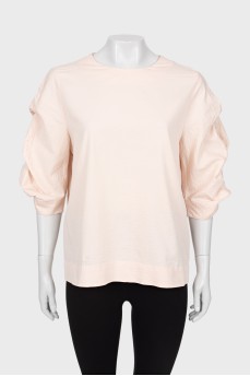 Pink blouse with voluminous sleeves