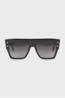 Black sunglasses with gold hardware