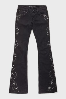 Black jeans with metallic rhinestones