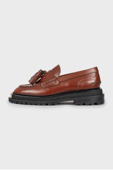 Brown loafers with tag