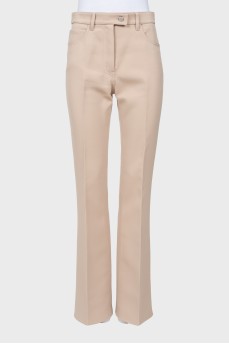 Beige flared trousers