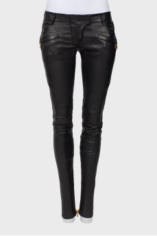Leather trousers with gold zippers