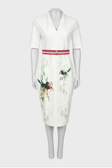 White dress with a pattern on the hem
