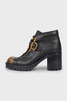 Black boots with gold toe