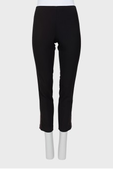 Black leggings decorated with stripes