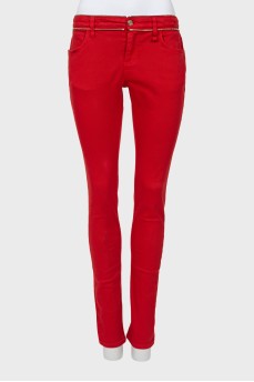 Red jeans with embellished waist