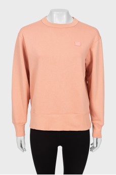 Pink sweatshirt with brand logo