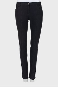 Black trousers with stitched creases