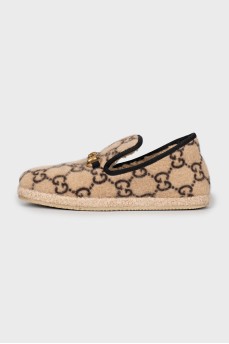 Fur moccasins with signature print