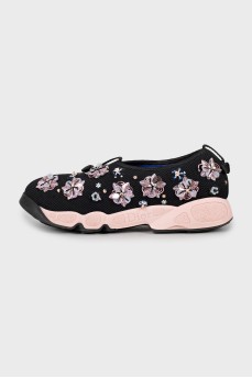 Textile sneakers decorated with flowers