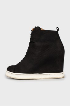 Black sneakers with perforations